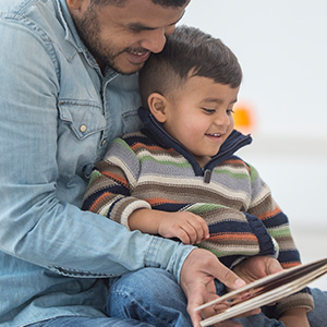 Dad reading with his son Dad reading with his son